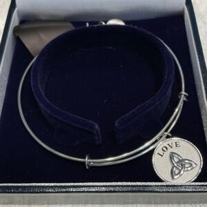 This item is a sterling silver Trinity knot bracelet ordered from "2" Day on Iri